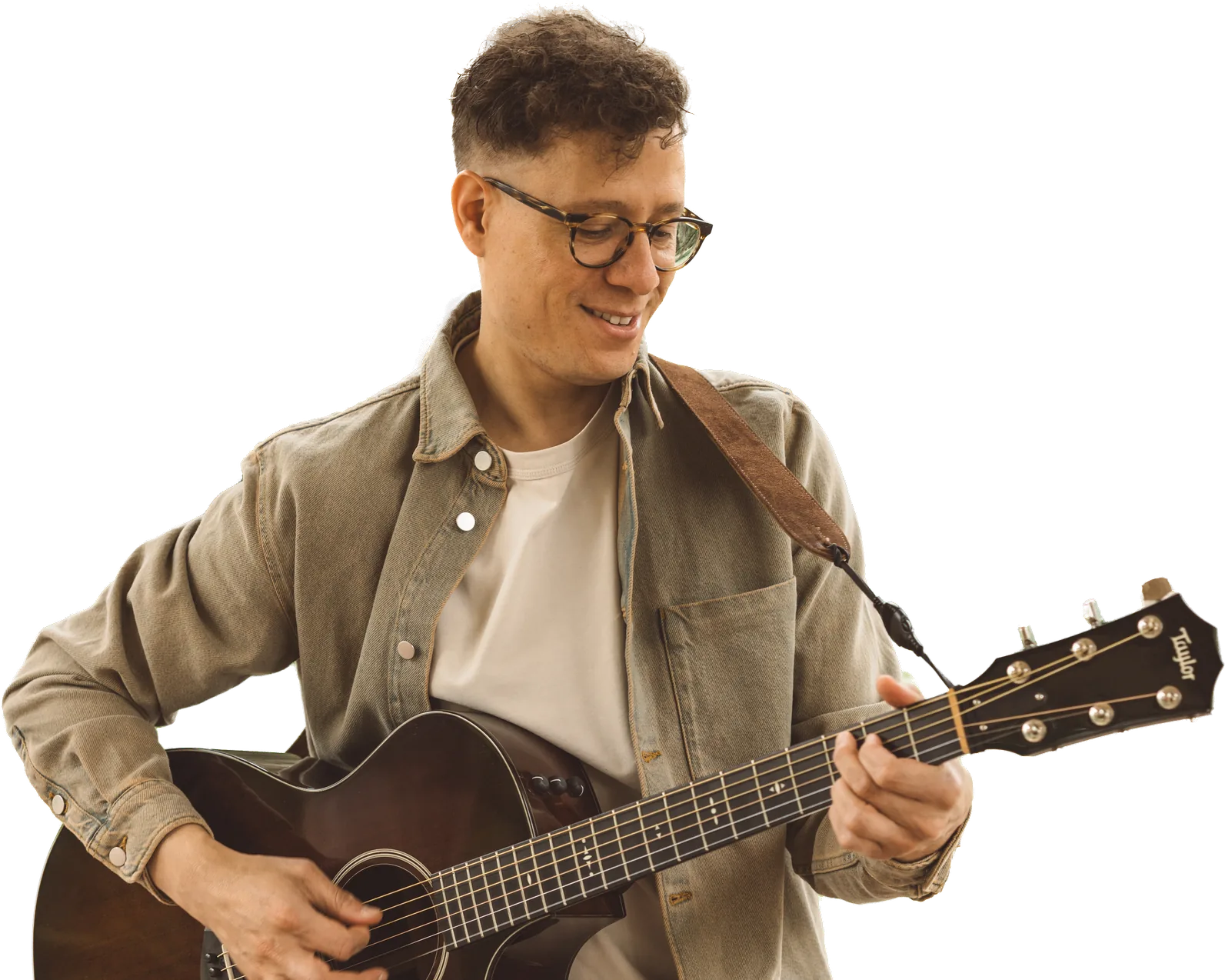 Enrique Gabriel playing an acoustic guitar, cut out from the background